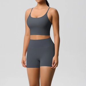 Detail view of charcoal grey yoga set featuring slim strap sports bra and high waist shorts