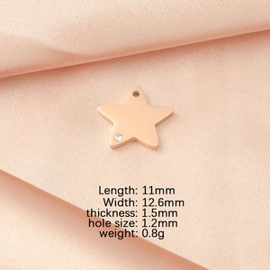 Macro detail of rose gold star pendant with crystal and precise dimensions info
