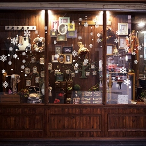 White snowflake window stickers for Christmas shop decoration on glass storefronts