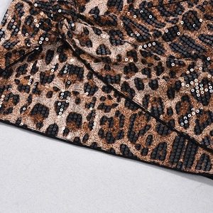 Detail of leopard print sequins on fabric showcasing high-quality material and texture
