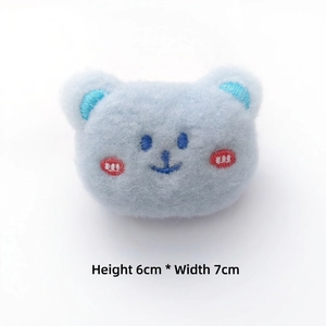 Detail of blue plush bear brooch showing 6x7cm dimensions and soft embroidered features