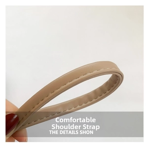 Detail of comfortable khaki PU leather shoulder strap with white contrast stitching