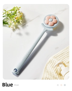 Close-up of blue long-handled bath brush with pink flower soft bristles for body exfoliation