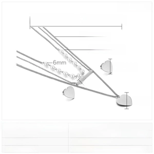 Detailed view of multilayer stainless steel necklace and heart earrings with dimensions