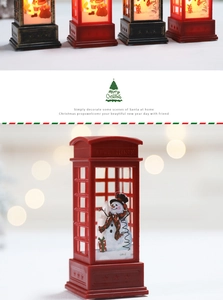 Close-up of red LED Christmas lantern with warm bokeh lights and festive decorations