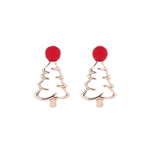 Detail view of gold Christmas tree stud earrings with festive red dot accents