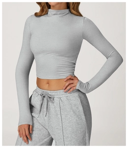Detailed view of grey long sleeve crop top and matching drawstring jogger set