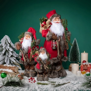 Standing Santa Claus figurines set in three sizes with red robes and festive accessories