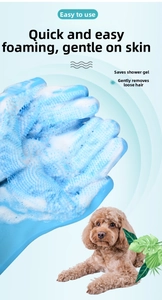 Blue silicone pet grooming glove showing rapid foaming and massage bristles on a poodle