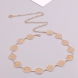 Macro view of golden hollow circle metal waist chain with adjustable lobster clasp detail