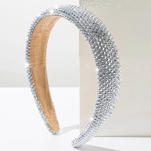 Detail view of the wide sponge headband with sparkling rhinestones and plush inner lining
