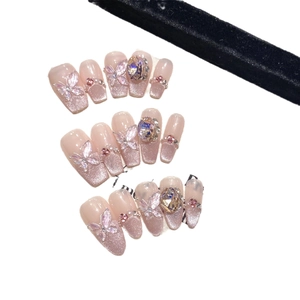 Handmade press-on nails with cat-eye glitter, 3D crystals, and pink butterfly accents