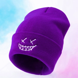 Close-up of a purple knitted beanie featuring a white embroidered smile face detail