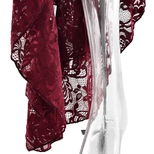 Detailed macro view of dark red lace fabric with intricate floral patterns on dress
