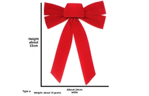 Detail view of large red velvet Christmas bow showing 33cm height and 24cm width dimensions