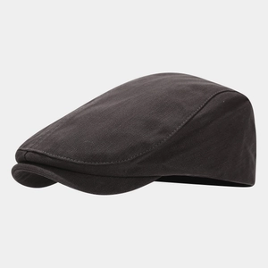 Detailed side view showing the fine texture of this dark brown retro flat cap for men and women