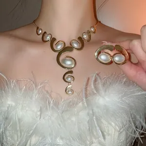 Golden oval tassel jewelry set with necklace and earrings on model with white fur