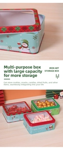 Close-up of festive Christmas tin boxes with transparent windows and holiday patterns
