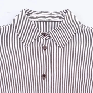 Detail of classic brown striped shirt collar and buttons on a white background