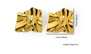 Detailed view of gold wave texture stud earrings with 2.7cm size and weight specs