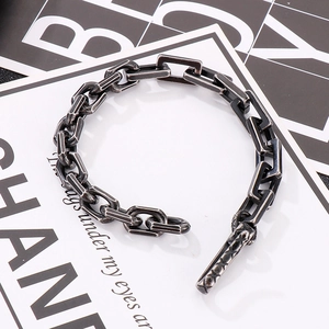 Macro view of retro industrial matte black metal chain links with toggle clasp detail