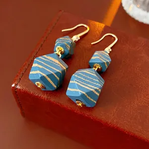 Bohemian geometric blue wood bead drop earrings with gold stripes and zircon accents