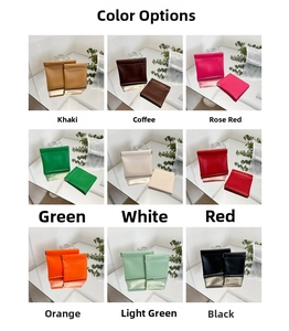 Nine colors of PU leather mini coin purses with squeeze closure displayed on mirrors