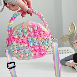 Detailed view of colorful rainbow silicone pop-it shoulder bag with heart bubbles