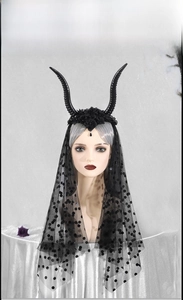 Detail of gothic black horns headband with polka dot mesh veil for Halloween costume