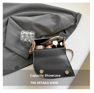 Detail showing the inner capacity of this square crossbody bag with daily essentials