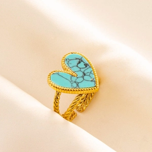 Detail of heart turquoise stone on gold woven ring band with adjustable design