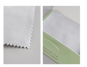 Macro detail of 10x7cm professional silver polishing cloth with serrated edges and texture