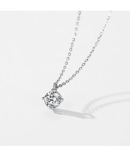 Macro view of a classic S925 sterling silver necklace with a brilliant four-prong solitaire