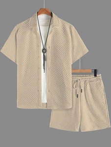 Detail of men's summer set showing apricot waffle texture fabric on shirt and shorts