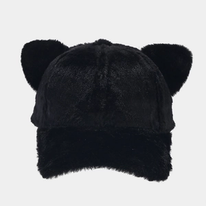 Close-up of black faux fur baseball cap with cute cat ears and soft fluffy texture