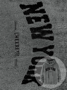 Detail of grey sherpa fleece fabric texture with New York embroidery on the hoodie