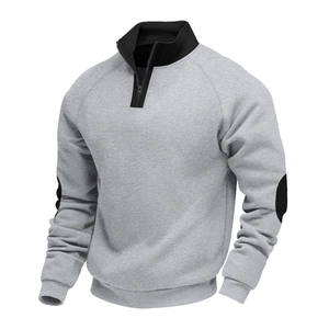Detail of grey half-zip sweatshirt with black stand collar and elbow patch highlights