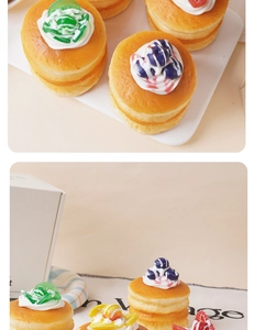Macro detail of artificial fruit souffle pancake model with creamy topping and berries