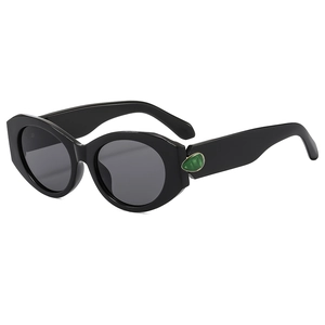 Fashionable black cat eye sunglasses for women with green gemstone temple detail