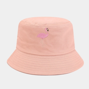 Close-up of pink cotton bucket hat featuring detailed flamingo embroidery and stitched brim