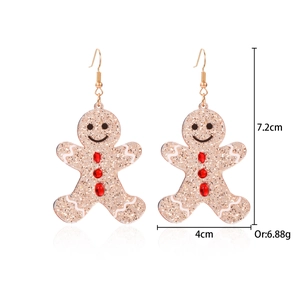 Detailed view of gingerbread man earrings with size measurements of 7.2cm by 4cm
