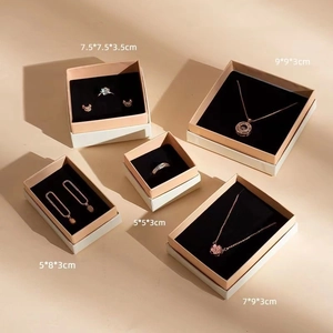 Pink and black jewelry gift boxes in various sizes for rings and necklaces