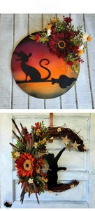 Close-up of Halloween moon cat wreath with sunflowers and autumn leaves for door decor