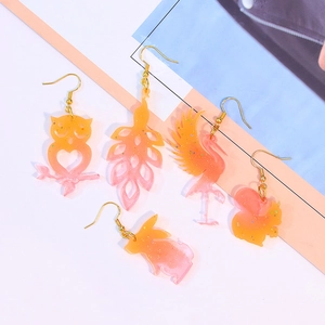 DIY resin animal earrings in cat and owl shapes with orange pink gradient finish