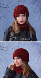 Detail of red and black chunky knit beanie and neck warmer set with fleece lining
