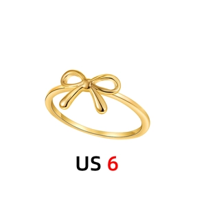 Macro detail of 18K gold bow ring showing the US size 6 measurement in a professional view