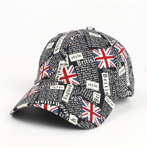 Detail of baseball cap featuring Union Jack flag prints and British graffiti typography
