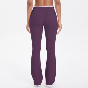 Rear view of high-waist flared yoga pants in dark purple with white waist trim details