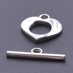 Macro shot of silver stainless steel heart-shaped OT toggle clasp for DIY jewelry