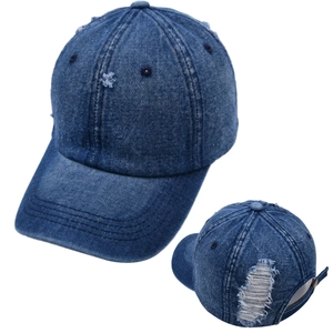 Detail of distressed blue denim baseball cap with heavy ripped back and adjustable strap